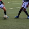 a couple of men playing football