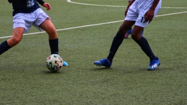 a couple of men playing football