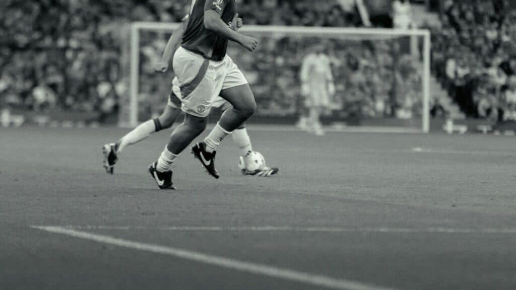 A group of men playing a game of soccer