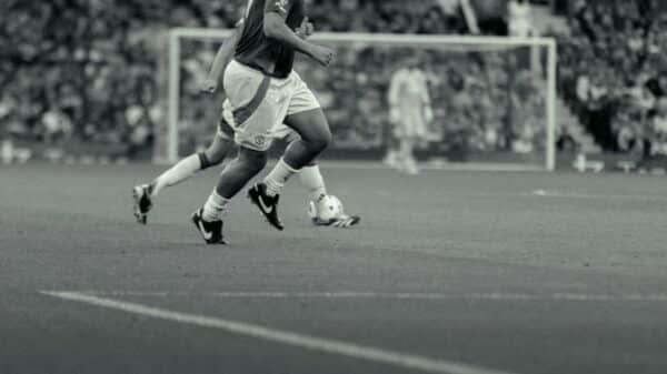 A group of men playing a game of soccer