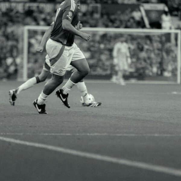 A group of men playing a game of soccer