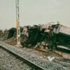 A train appears derailled and severely damaged