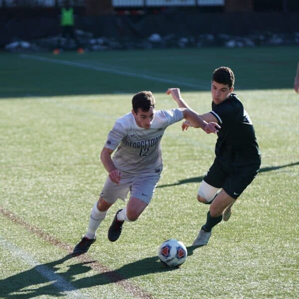 man playing soccer on the field