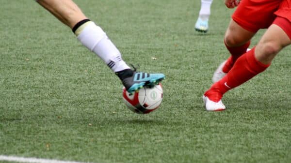 a couple of men playing a game of soccer