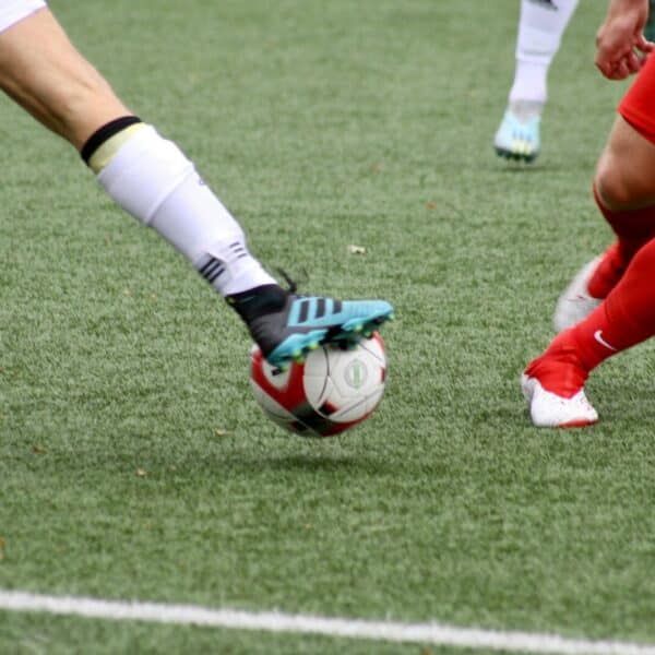 a couple of men playing a game of soccer